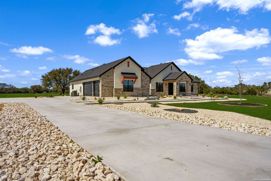 Front exterior of a new home in , Bandera, TX, highlighting curb appeal (Image 25). Front exterior of a new home in , Bandera, TX, highlighting curb appeal (Image 25).