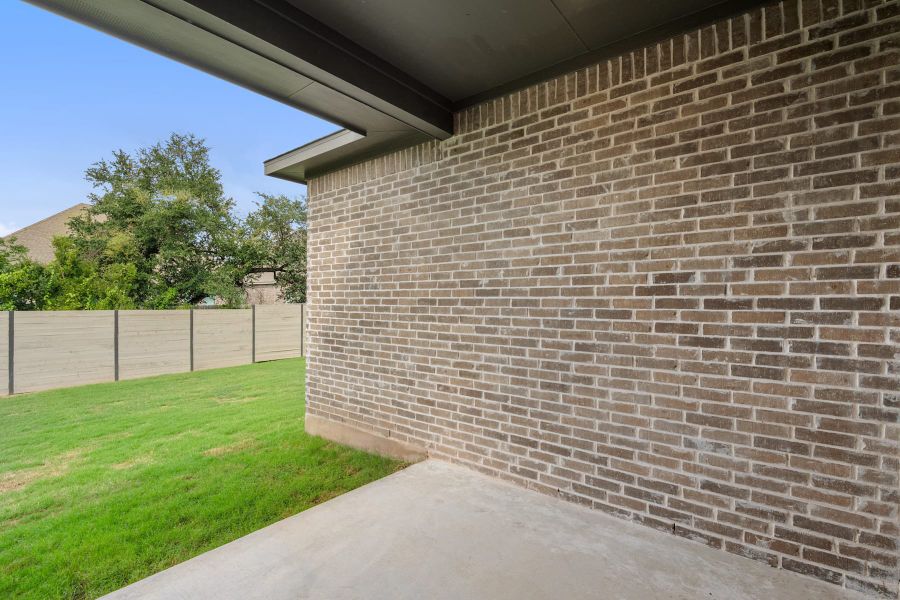 Exterior details and patio area of a home in Wolf Ranch, Georgetown (Image 27).