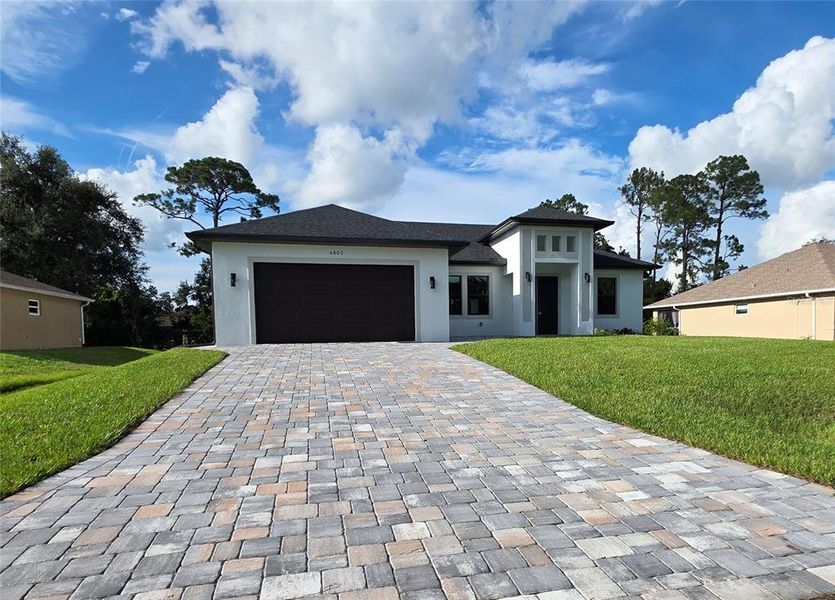 Front exterior of a new home in , North Port, FL, highlighting curb appeal (Image 11).