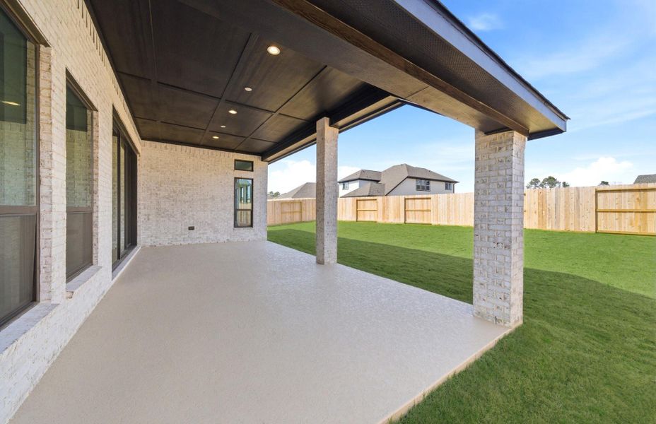 Exterior details and patio area of a home in The Highlands 55′, Porter (Image 26).