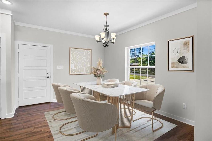 Dining room with a chandelier, crown molding, and dark wood-style floors
