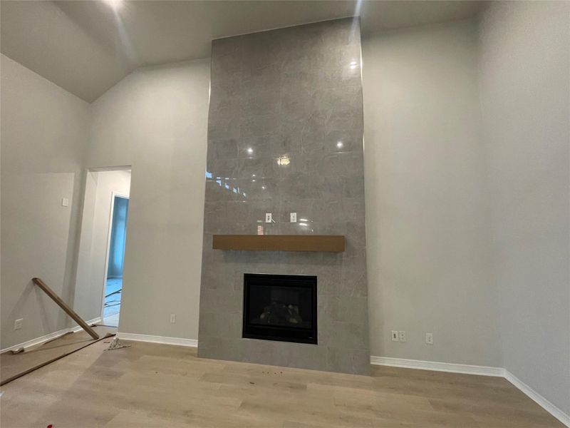 Soaring Ceilings and Beautiful Fireplace details in Family Room