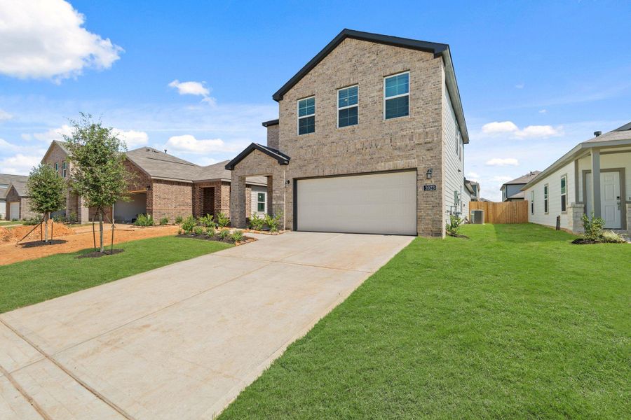 Front exterior of a new home in Laurel Farms, Brookshire, TX, highlighting curb appeal (Image 2). Front exterior of a new home in Laurel Farms, Brookshire, TX, highlighting curb appeal (Image 2).