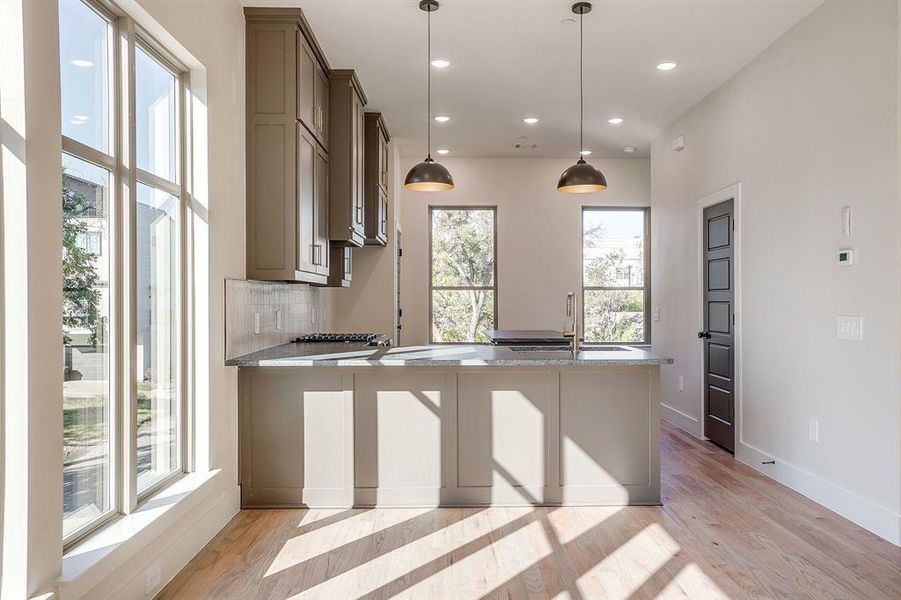 Sleek and spacious kitchen perfect for entertaining or everyday cooking. Sleek and spacious kitchen perfect for entertaining or everyday cooking.