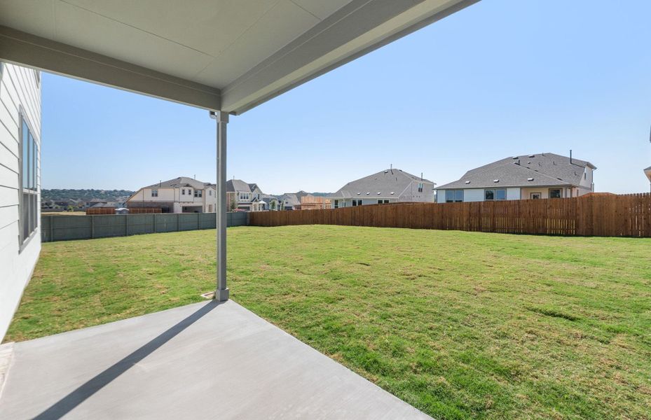 Exterior details and patio area of a home in Saddleback at Santa Rita Ranch, Liberty Hill (Image 24). Exterior details and patio area of a home in Saddleback at Santa Rita Ranch, Liberty Hill (Image 24).