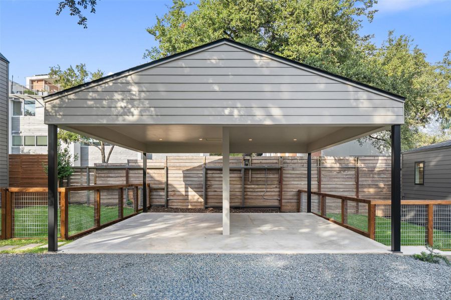 View of parking featuring a carport