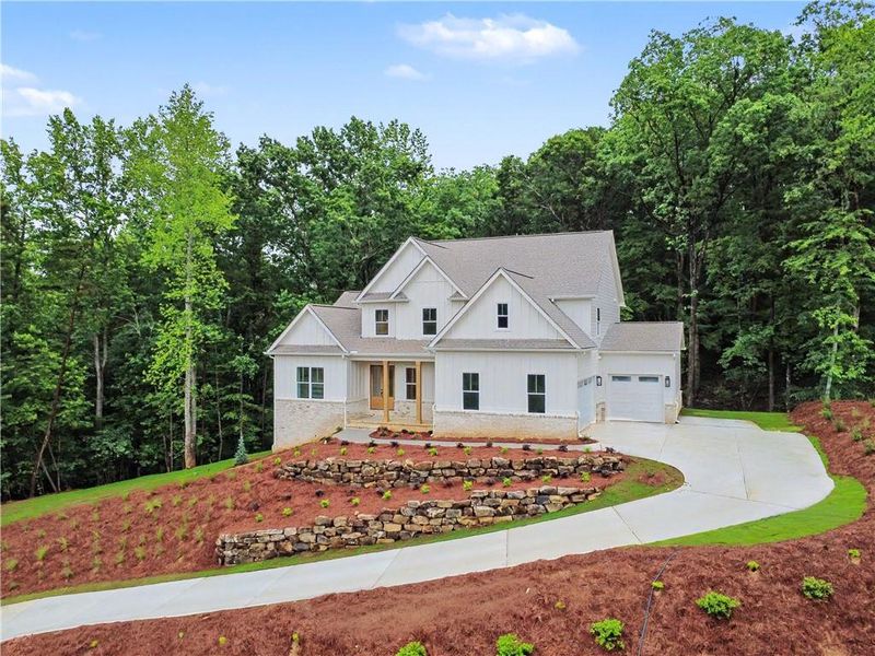 Front exterior of a new home in , Gainesville, GA, highlighting curb appeal (Image 1). Front exterior of a new home in , Gainesville, GA, highlighting curb appeal (Image 1).