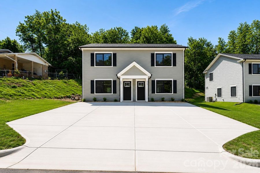 Front exterior of a new home in , Conover, NC, highlighting curb appeal (Image 13).