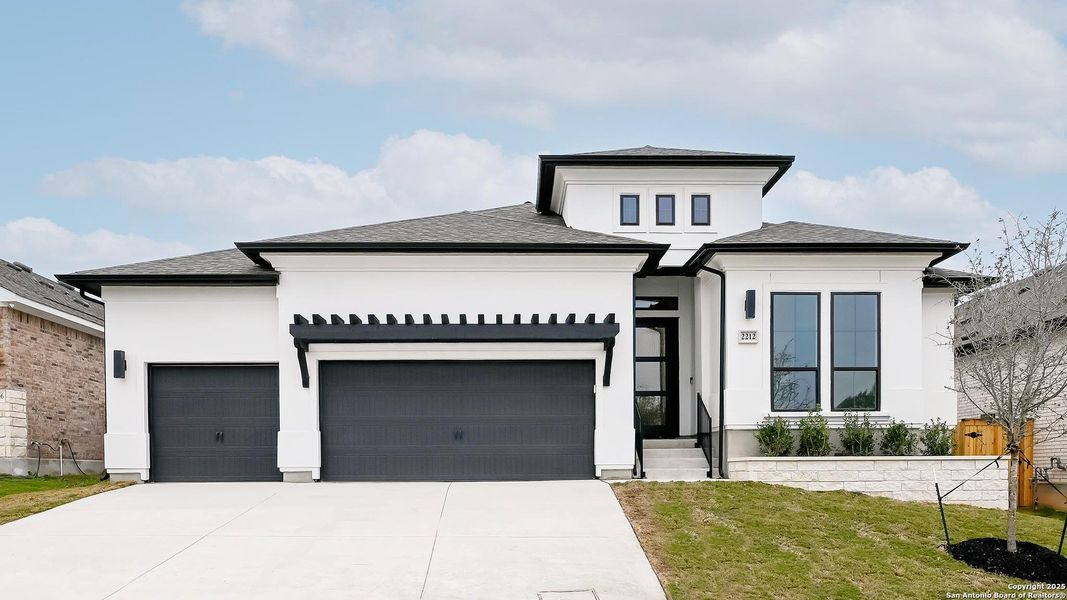 Front exterior of a new home in Veramendi 60', New Braunfels, TX, highlighting curb appeal (Image 25).