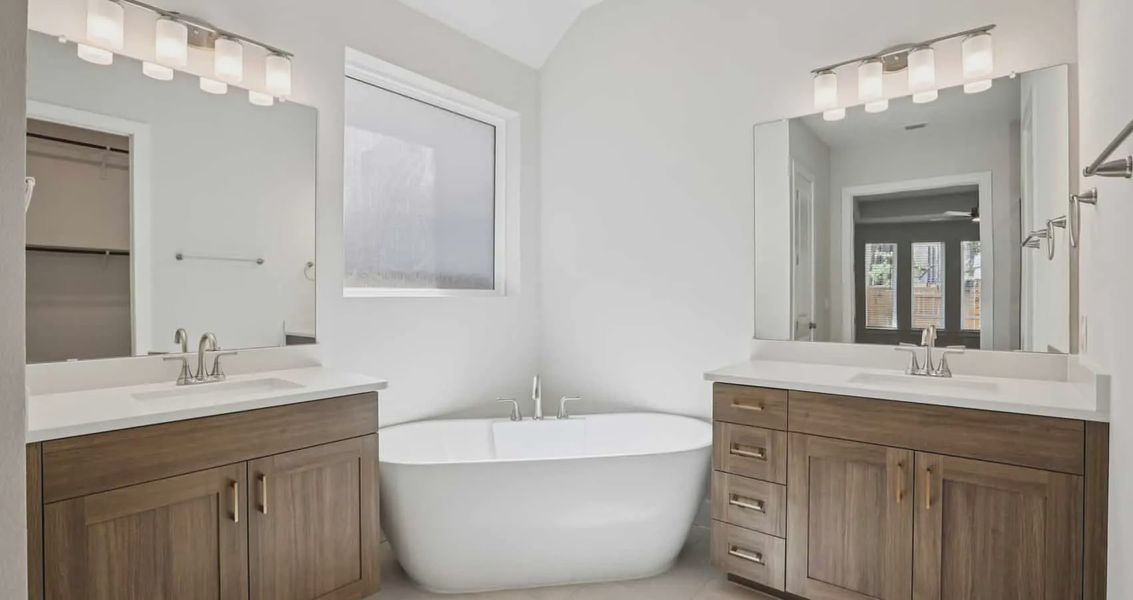 Furnished interior view inside a new home in 6 Creeks, Kyle (Image 8).