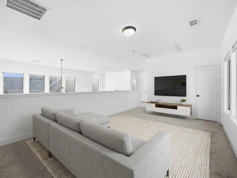 Upstairs game room featuring baseboards Upstairs game room featuring baseboards