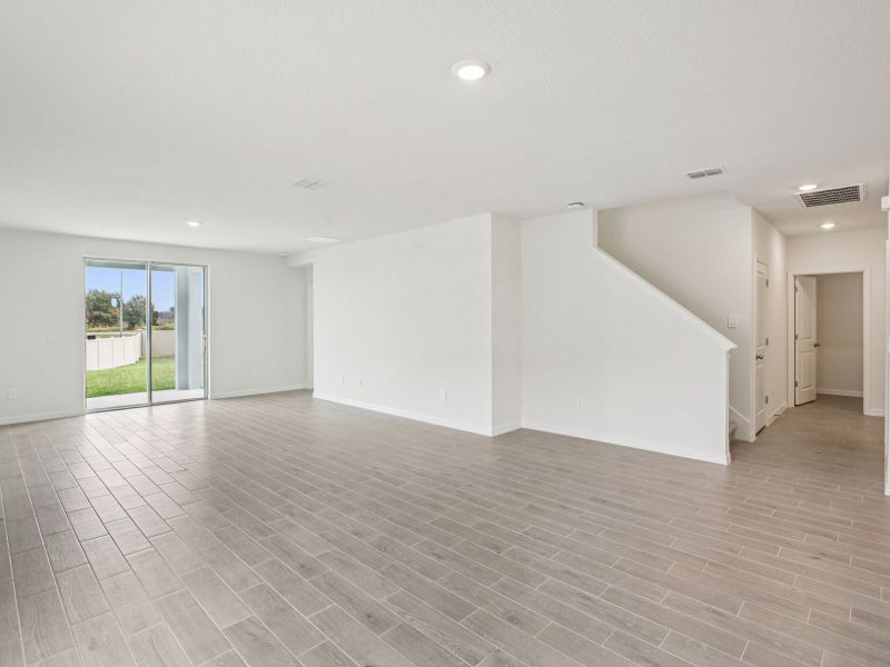 Spacious, unfurnished interior of a new home in The Grove at Stuart Crossing - Classic Series, Bartow (Image 9).