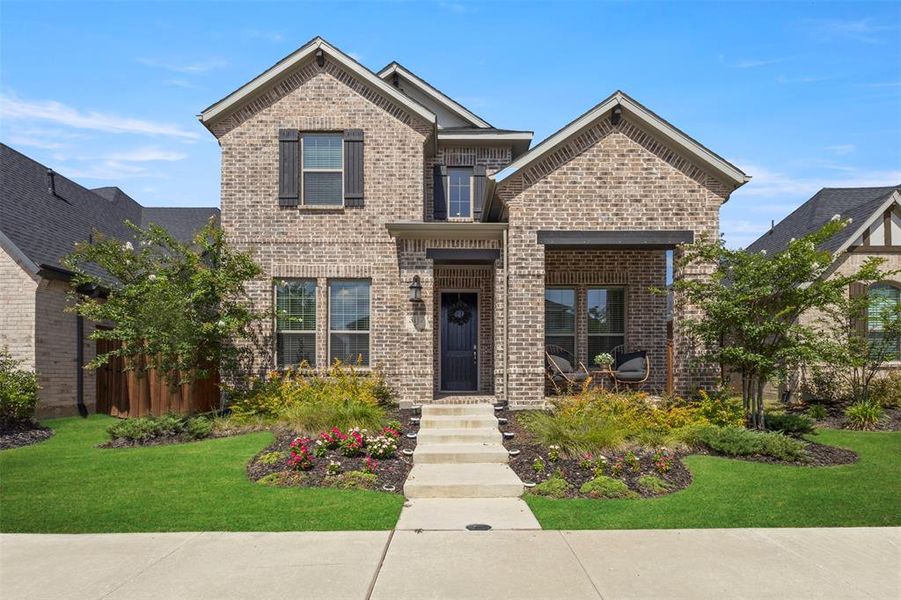 Front exterior of a new home in Mustang Lakes 74', Celina, TX, highlighting curb appeal (Image 2).