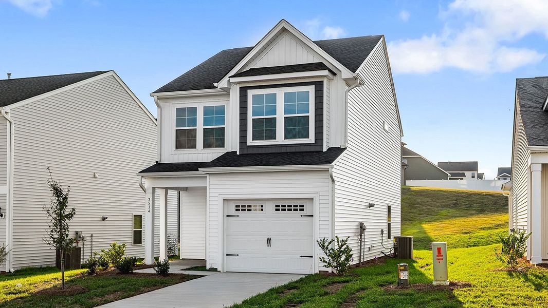 Front exterior of a new home in Hanes Lake, Winston-Salem, NC, highlighting curb appeal (Image 1). Front exterior of a new home in Hanes Lake, Winston-Salem, NC, highlighting curb appeal (Image 1).
