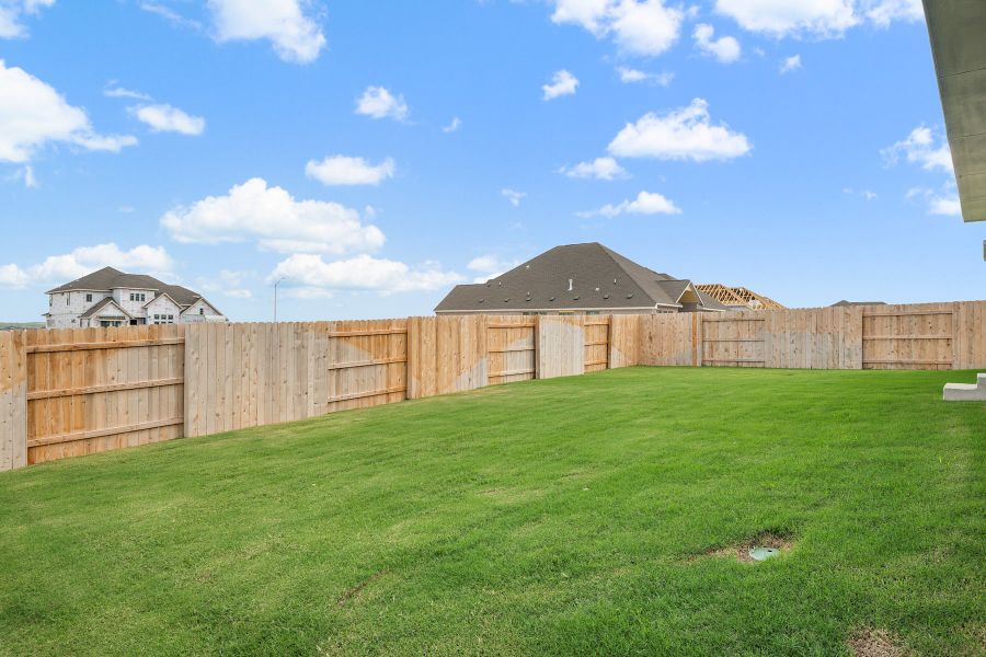 Exterior details and patio area of a home in Lariat, Liberty Hill (Image 28).