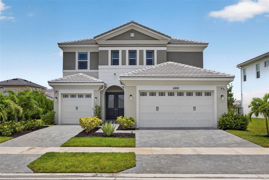 Front exterior of a new home in , Westlake, FL, highlighting curb appeal (Image 23).