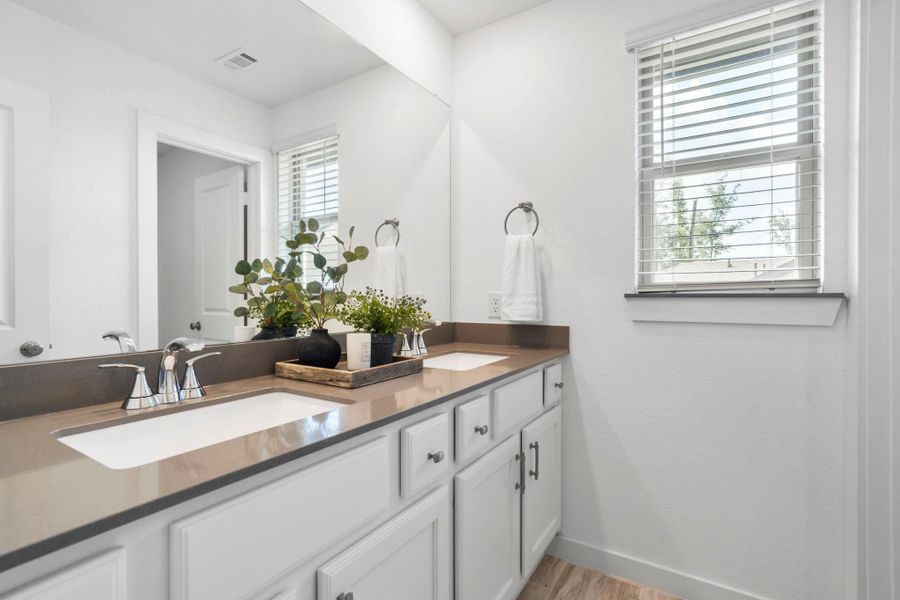 Full-sized upstairs bathroom with dual vanities Full-sized upstairs bathroom with dual vanities