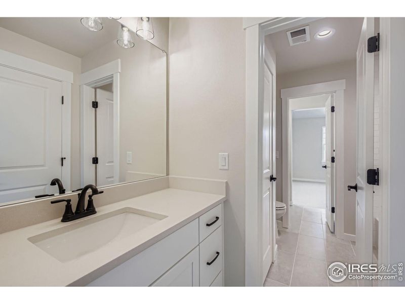 Furnished interior view inside a new home in RainDance National 60/70, Windsor (Image 9).