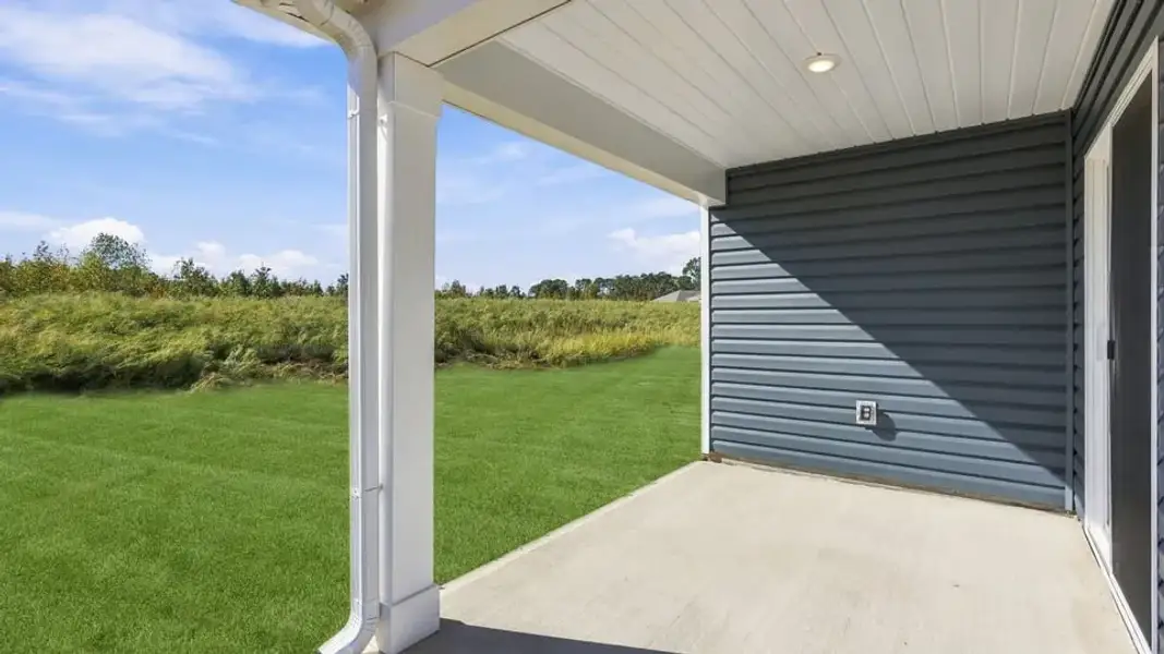 Exterior details and patio area of a home in Waverly Station, Greenwood (Image 19).