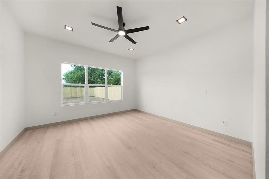 Spare room with baseboards, recessed lighting, ceiling fan, and wood finished floors