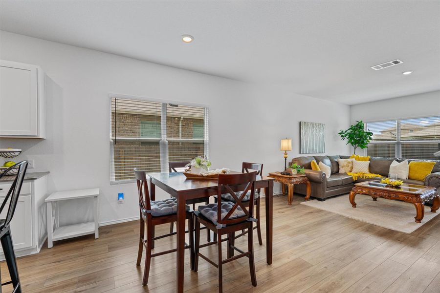 Dining area featuring light wood-type flooring and recessed lighting