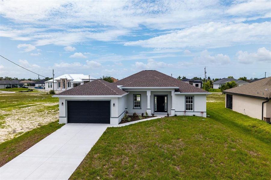 Front exterior of a new home in , Cape Coral, FL, highlighting curb appeal (Image 19).