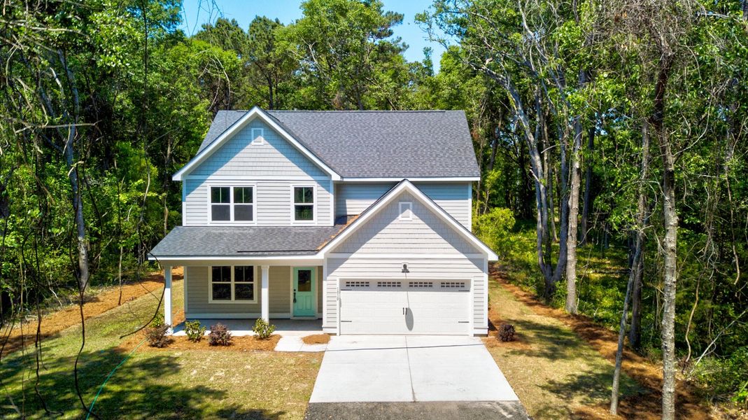 Front exterior of a new home in , Charleston, SC, highlighting curb appeal (Image 21).