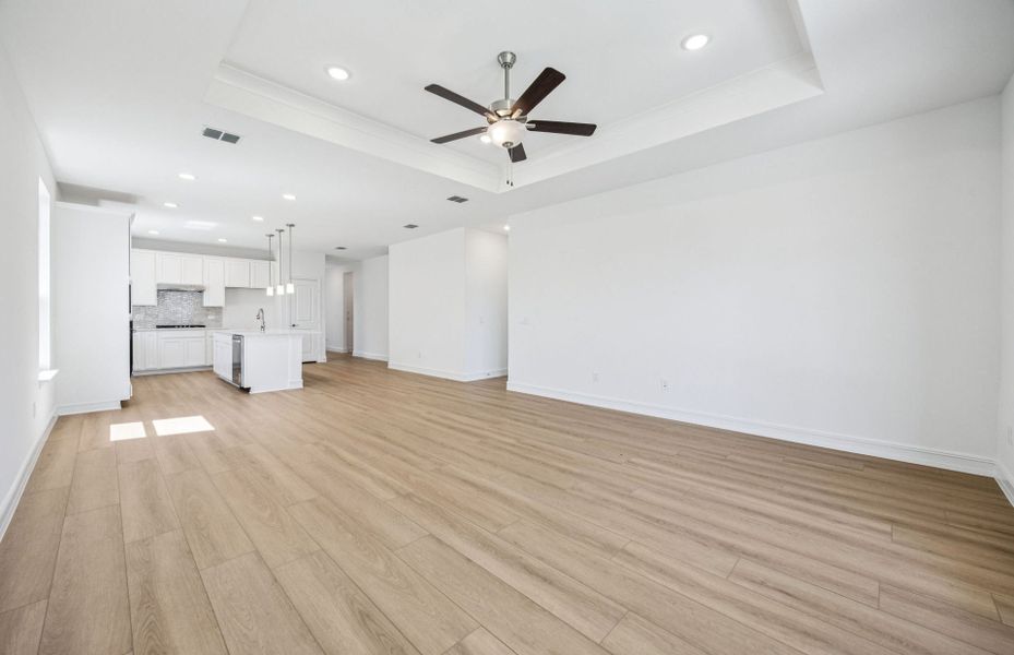 Elegant gathering room with tray ceiling *real home pictured