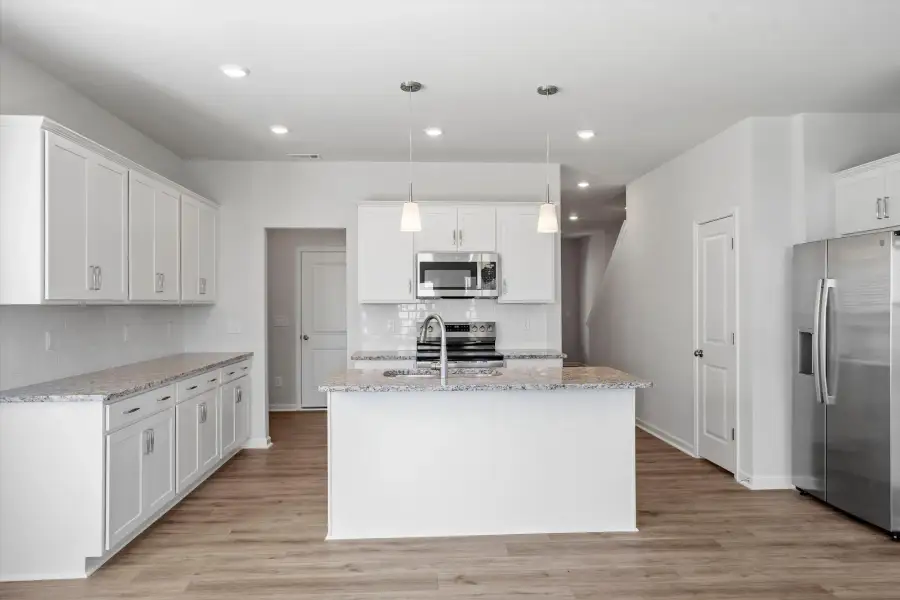 Furnished interior view inside a new home in West Main Townhomes, Sanford (Image 6).