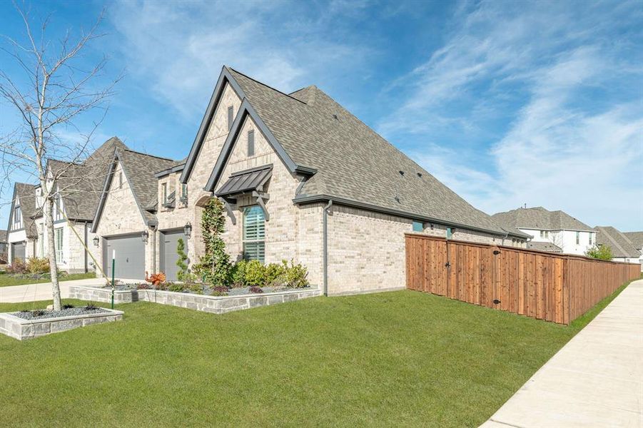 Front exterior of a new home in Trinity Falls, McKinney, TX, highlighting curb appeal (Image 27).