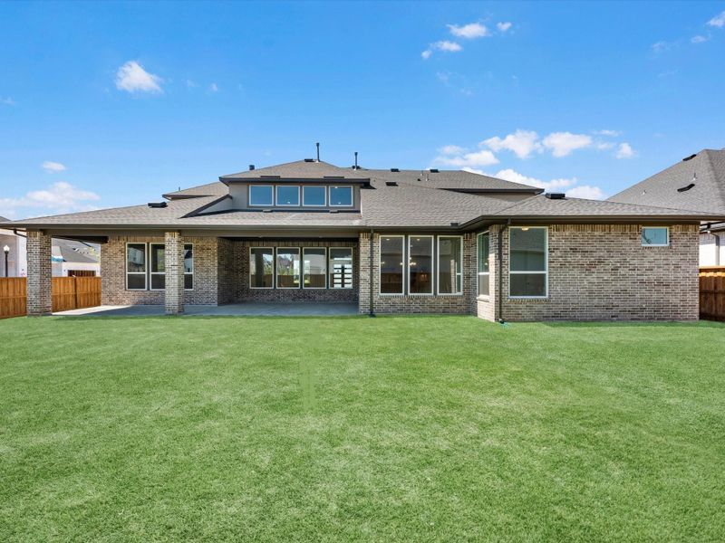 Exterior details and patio area of a home in Woodson’s Reserve, Spring (Image 3).