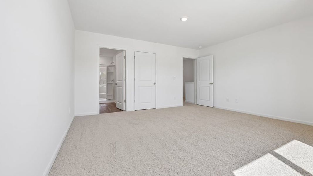 Spacious, unfurnished interior of a new home in The Townes at Belle Grove, Wendell (Image 10).