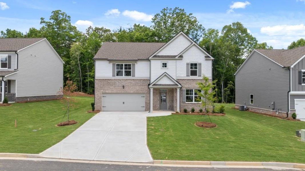 Front exterior of a new home in Parkside at Carter Grove, Cartersville, GA, highlighting curb appeal (Image 2).