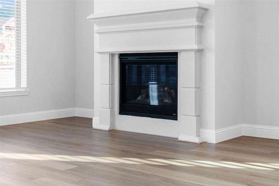 Gather around the stunning gas fireplace, featuring a classic white mantel with elegant clean lines that serve as the heart of this sun-filled living space. Gather around the stunning gas fireplace, featuring a classic white mantel with elegant clean lines that serve as the heart of this sun-filled living space.