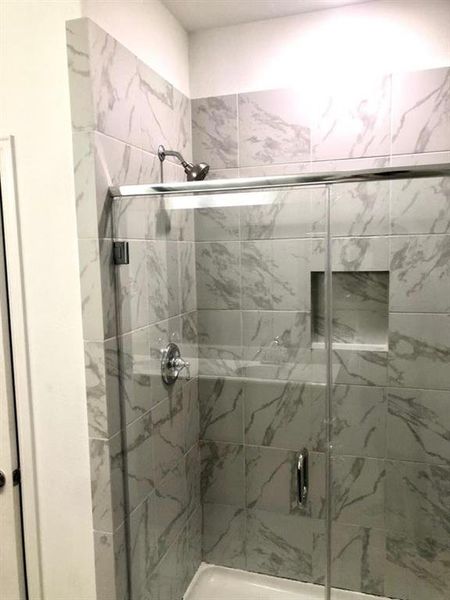 Full bathroom with a stall shower Full bathroom with a stall shower