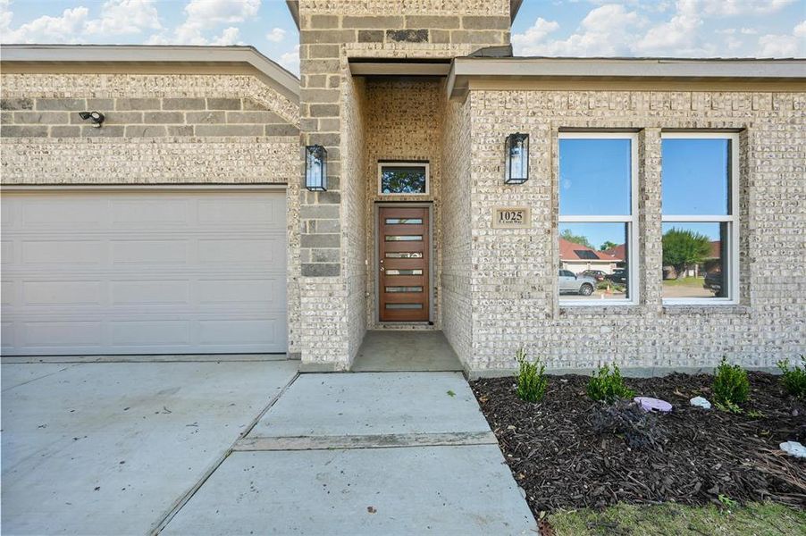 Property entrance featuring a garage