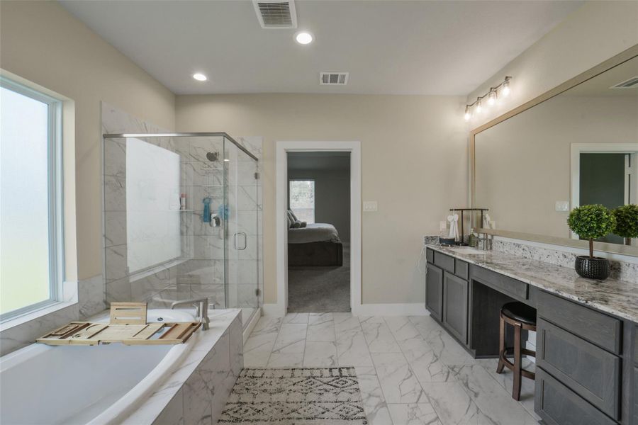 Soaking tub and separate shower create a relaxing atmosphere.