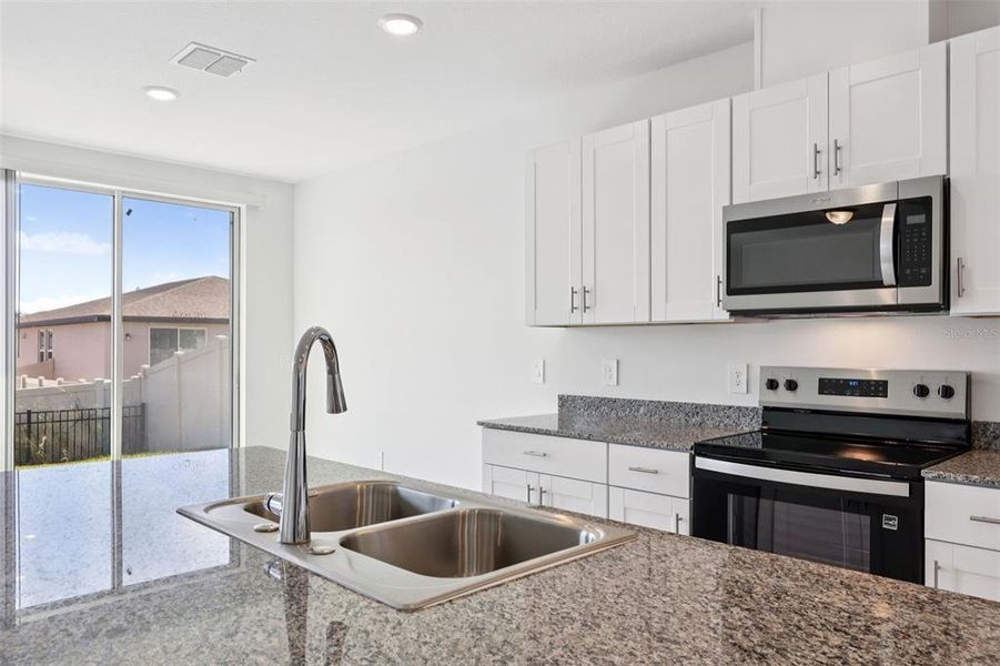 Furnished interior view inside a new home in Deer Run at Crosswinds, Davenport (Image 5).