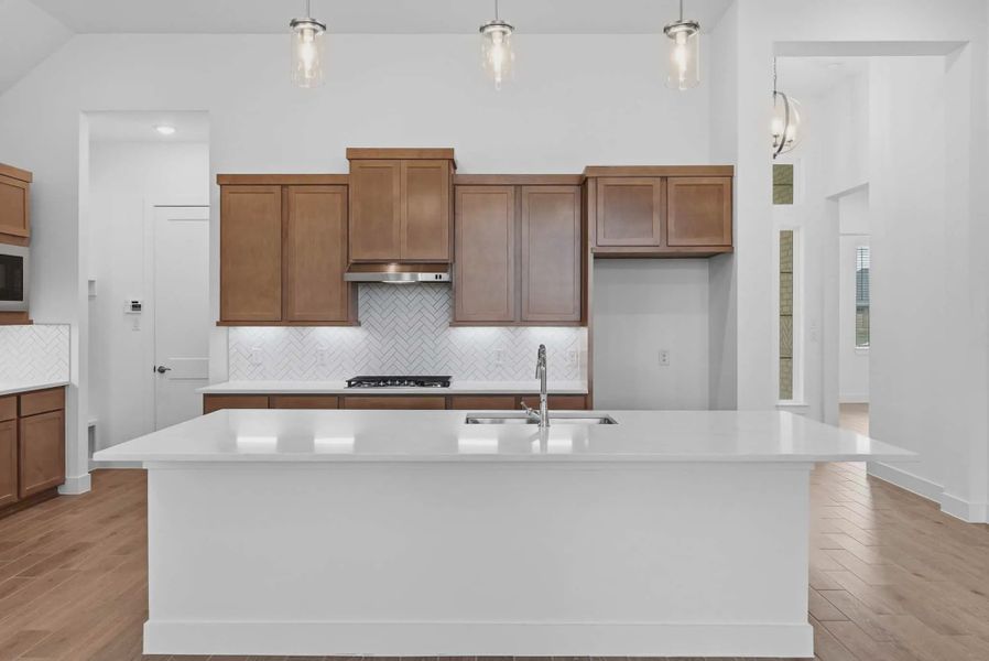Representative furnished interior of a home built from the Summerton by Chesmar Homes in Beacon Point, Texas City (Image 9).