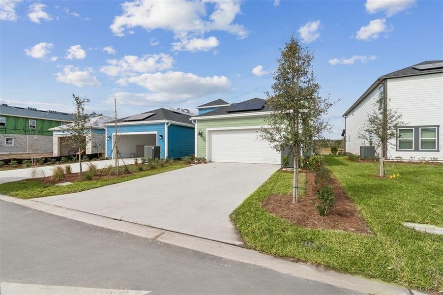 Front exterior of a new home in Laureate Park at Lake Nona - Garden Series, Orlando, FL, highlighting curb appeal (Image 24).