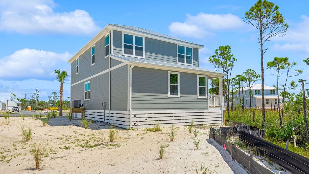 Front exterior of a new home in Redfish Cove at Cape San Blas, Port Saint Joe, FL, highlighting curb appeal (Image 24). Front exterior of a new home in Redfish Cove at Cape San Blas, Port Saint Joe, FL, highlighting curb appeal (Image 24).