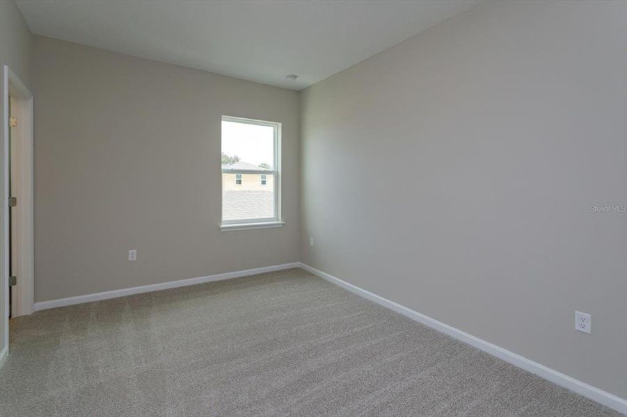 Spacious, unfurnished interior of a new home in Serenade at Ovation, Winter Garden (Image 21).