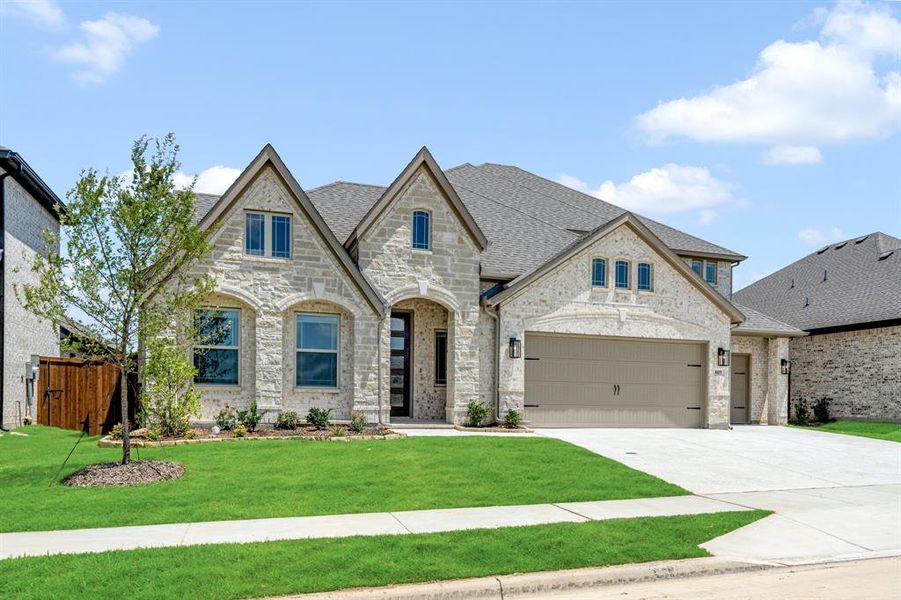 Front exterior of a new home in Wildflower Ranch 60-65, Justin, TX, highlighting curb appeal (Image 1). Front exterior of a new home in Wildflower Ranch 60-65, Justin, TX, highlighting curb appeal (Image 1).