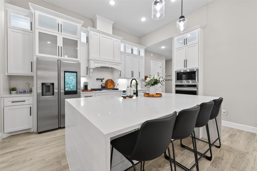 Spacious kitchen featuring extensive cabinetry and prep space. Spacious kitchen featuring extensive cabinetry and prep space.