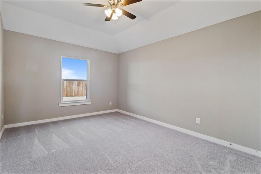 Bedroom with ceiling fan and carpet
