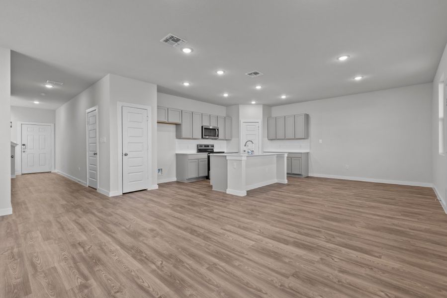 A large kitchen with white cabinets.