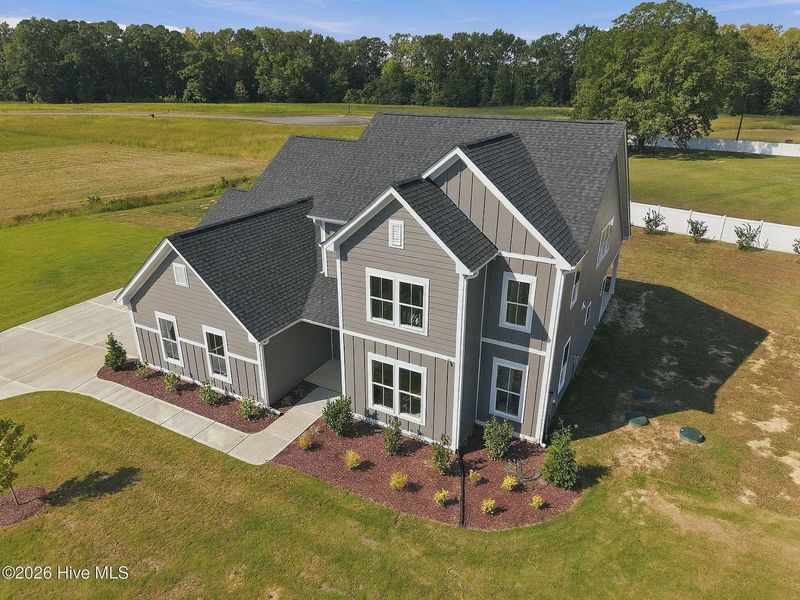 Front exterior of a new home in Dixon Grove, Grimesland, NC, highlighting curb appeal (Image 28).
