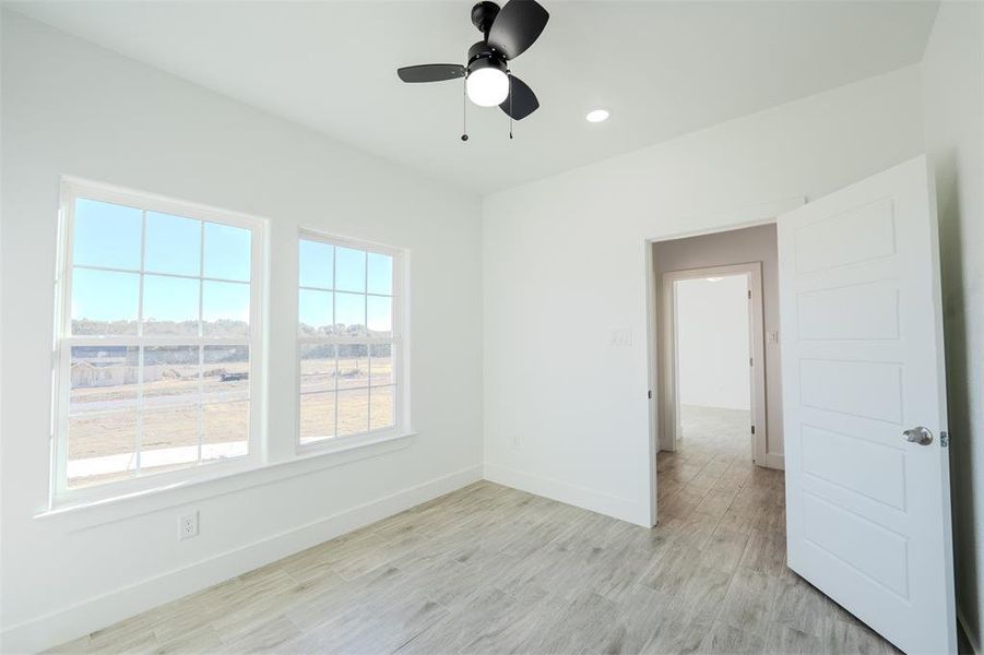 Spare room featuring light wood-style floors, recessed lighting, and ceiling fan Spare room featuring light wood-style floors, recessed lighting, and ceiling fan
