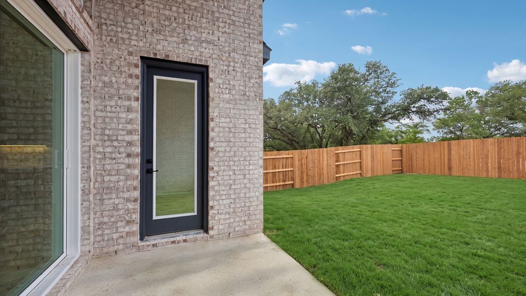 Exterior details and patio area of a home in The Enclave at Bar W Ranch, Leander (Image 4).