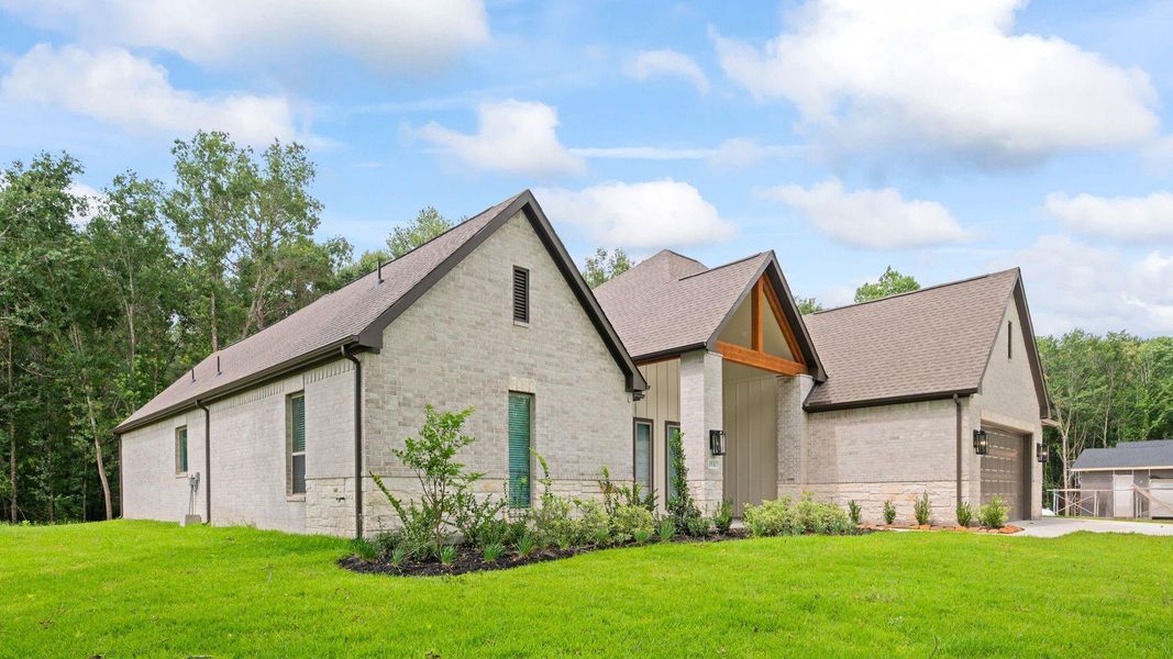 Front exterior of a new home in Silver Creek Ranch, Montgomery, TX, highlighting curb appeal (Image 24). Front exterior of a new home in Silver Creek Ranch, Montgomery, TX, highlighting curb appeal (Image 24).